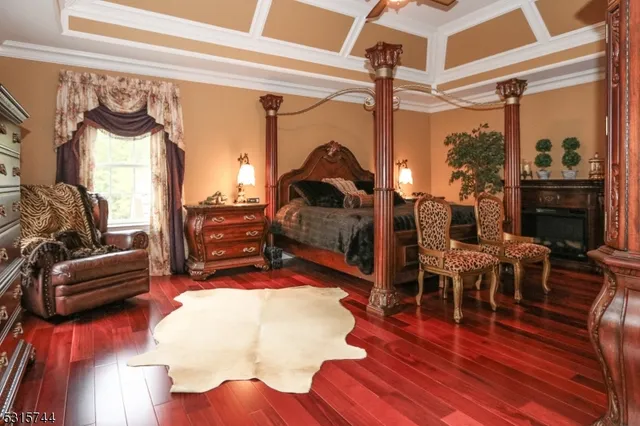 a bedroom with furniture and wooden floor