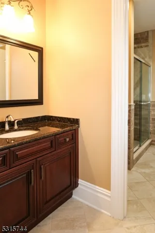 a bathroom with a sink and a mirror
