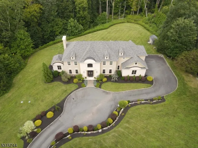 an aerial view of a house with outdoor space