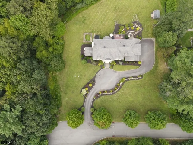 an aerial view of a house with a garden