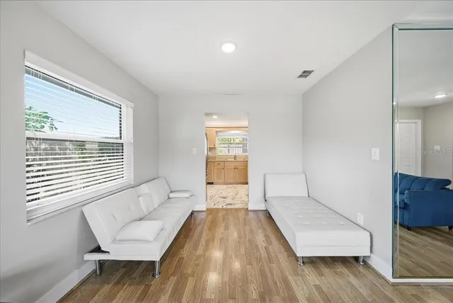 a living room with furniture and a window