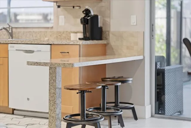 a view of a refrigerator with wooden floor