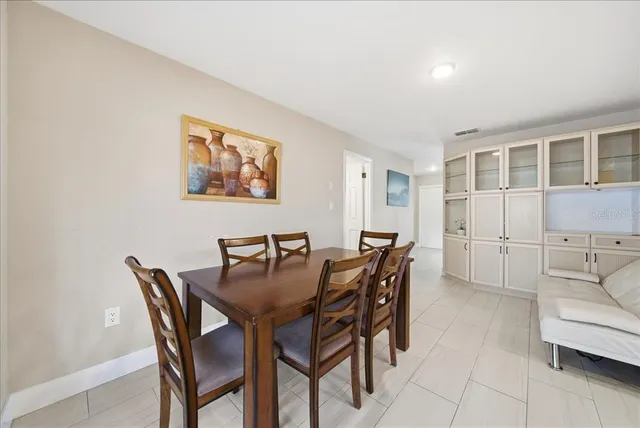 a view of a dining room and livingroom with furniture