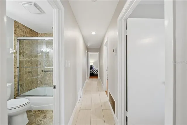 a bathroom with a shower and a toilet