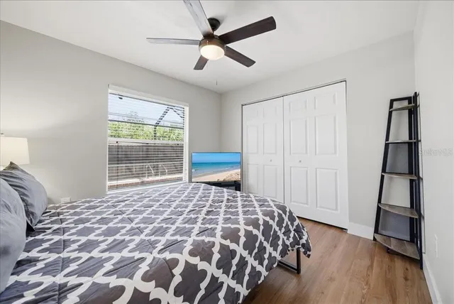 a bedroom with a bed and a window