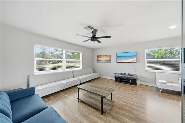 a living room with furniture and a window