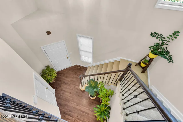 a view of staircase with wooden floor