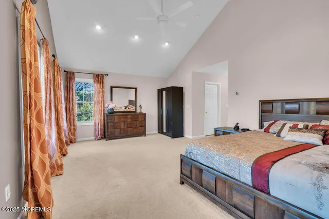 a bedroom with furniture and a chandelier