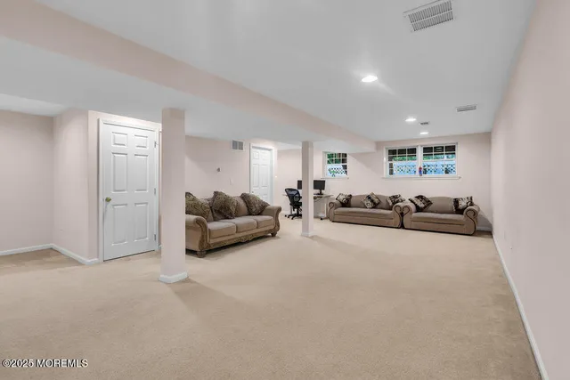 a living room with furniture and a table