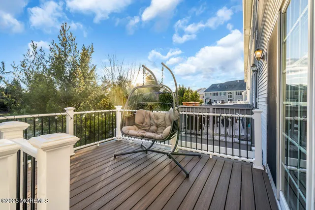 a view of a chairs and table in the back yard of the house
