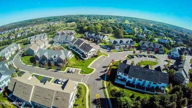 an aerial view of residential house with outdoor space and swimming pool