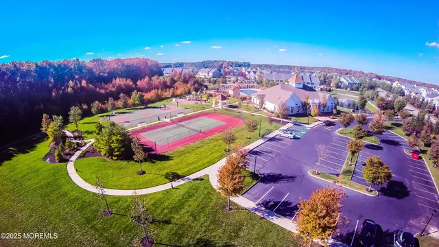 a view of a field and basketball court