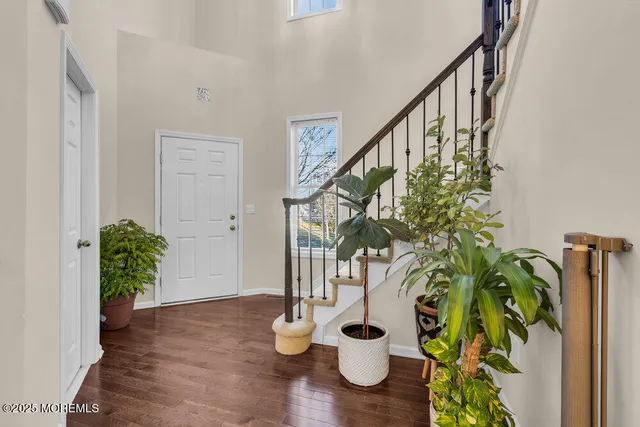a view of entryway with wooden floor