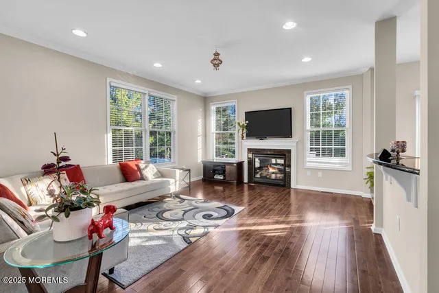 a living room with furniture fireplace and a flat screen tv
