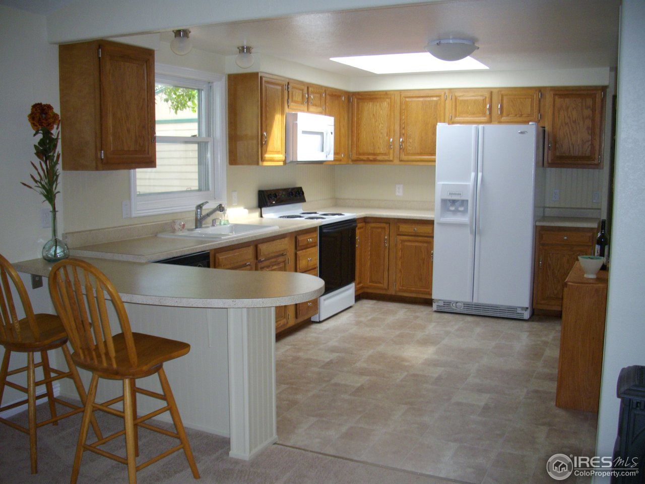 6323 Corinth Road Longmont, CO 80503 - Photo 2 of 23 Spacious kitchen with seating