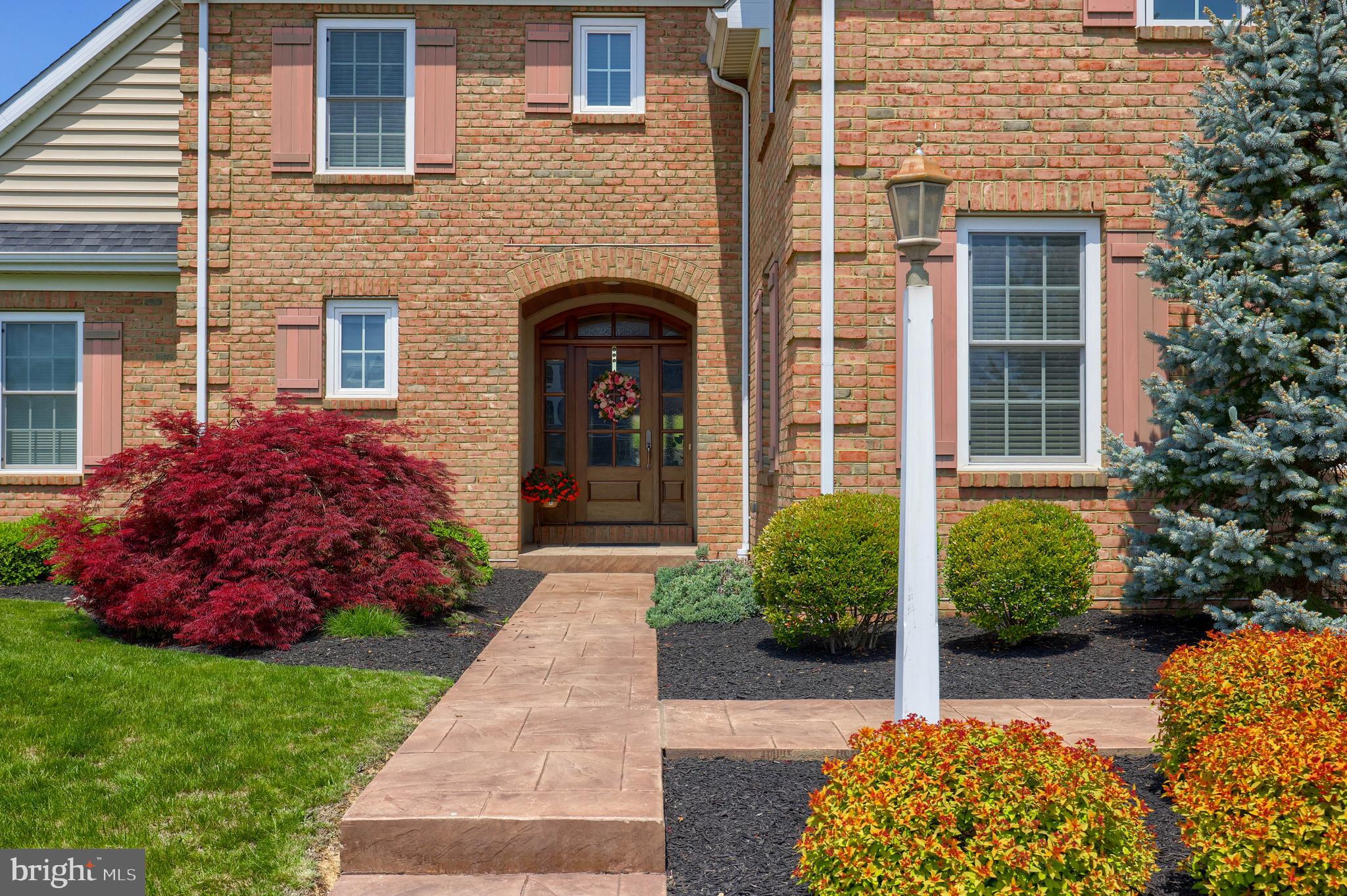 503 East Delp Road Lancaster, PA 17601 - Photo 8 of 77 Stamped concrete lead to a stunning all wood entra