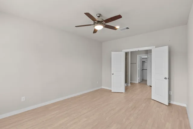 a view of an empty room with a window