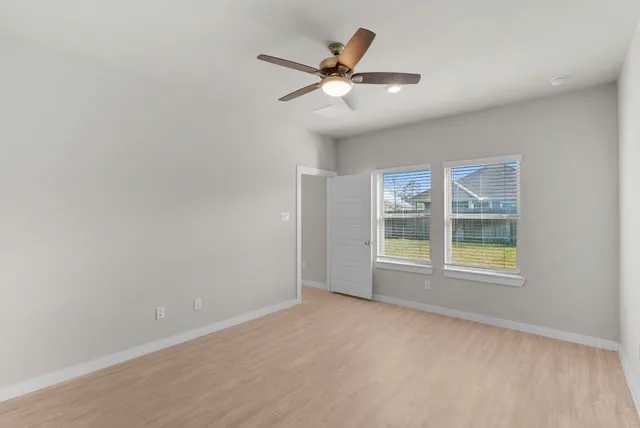 a bathroom with double vanity sinks and a mirror