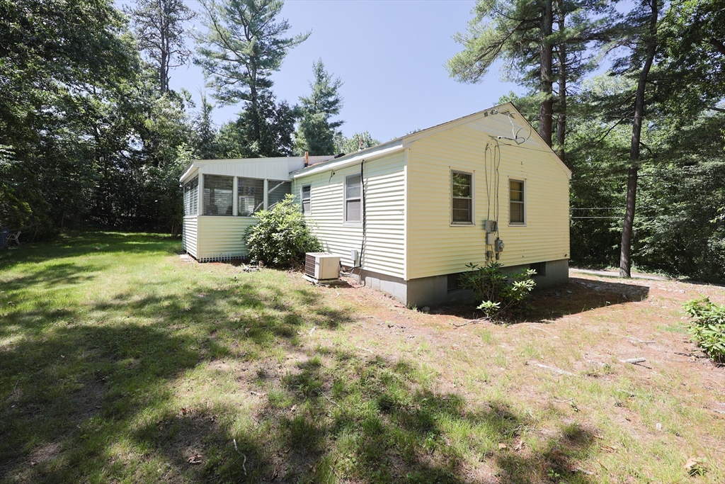 194 Indian Lane Canton, MA 02021 - Photo 2 of 5 a view of a house with backyard and trees