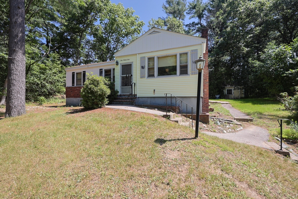 194 Indian Lane Canton, MA 02021 - Photo 4 of 5 a view of a house with backyard and trees