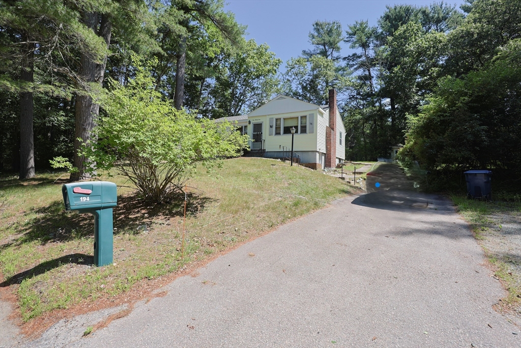 194 Indian Lane Canton, MA 02021 - Photo 5 of 5 a view of a house with backyard and a patio