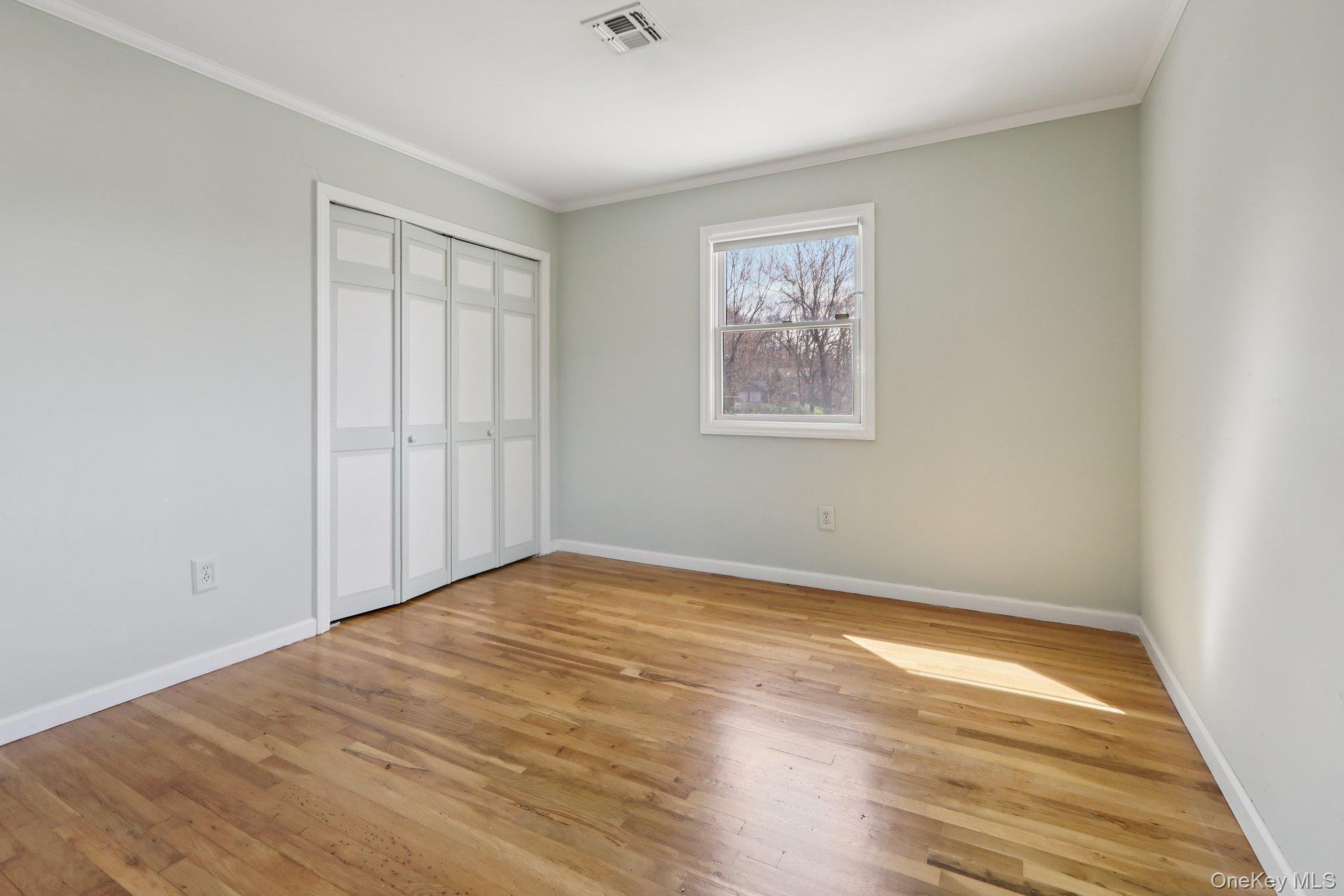 17 Rolling Ridge Road New City, NY 10956 - Photo 29 of 50 an empty room with wooden floor and windows