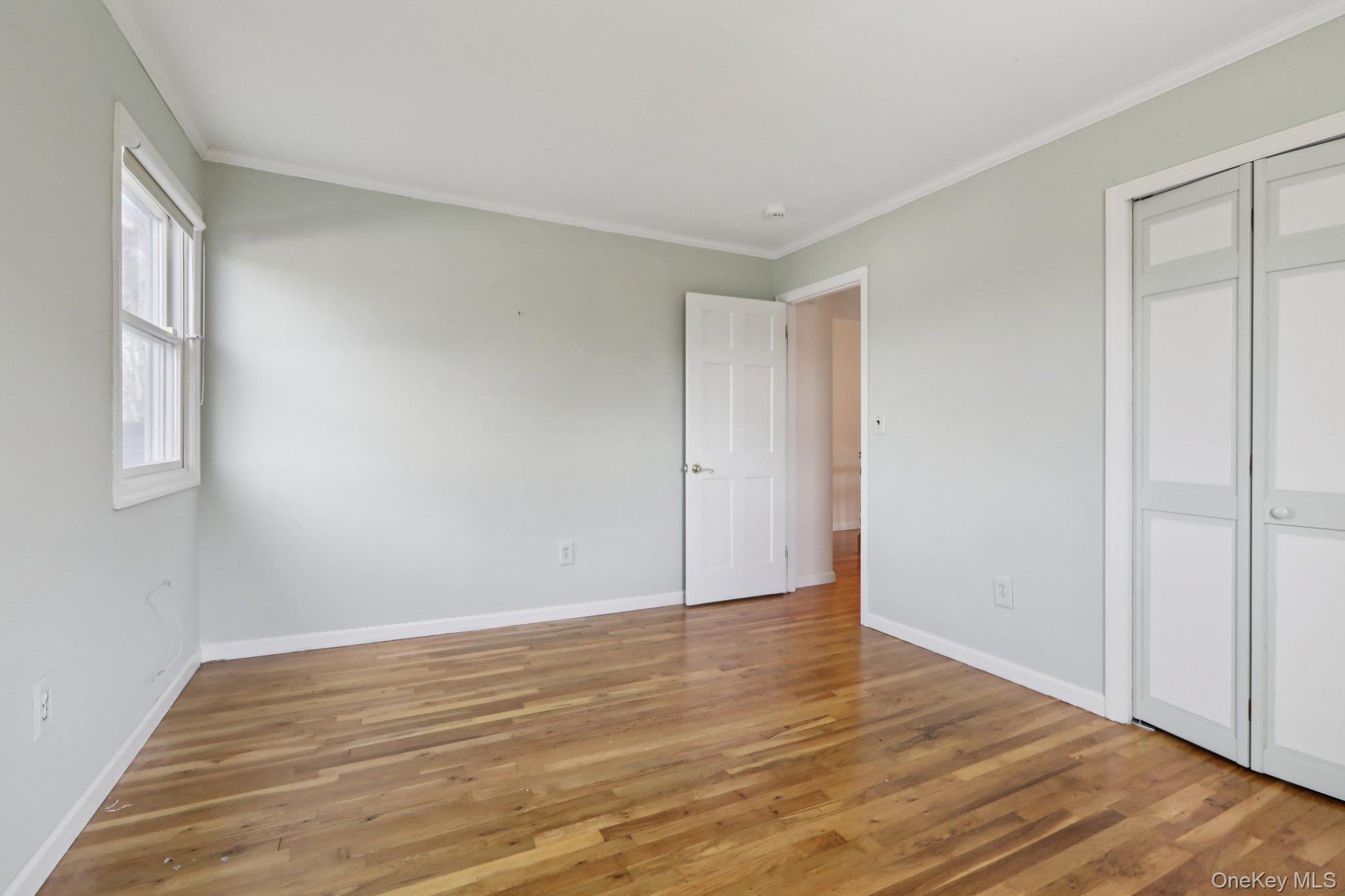 17 Rolling Ridge Road New City, NY 10956 - Photo 30 of 50 a view of an empty room with wooden floor and a window