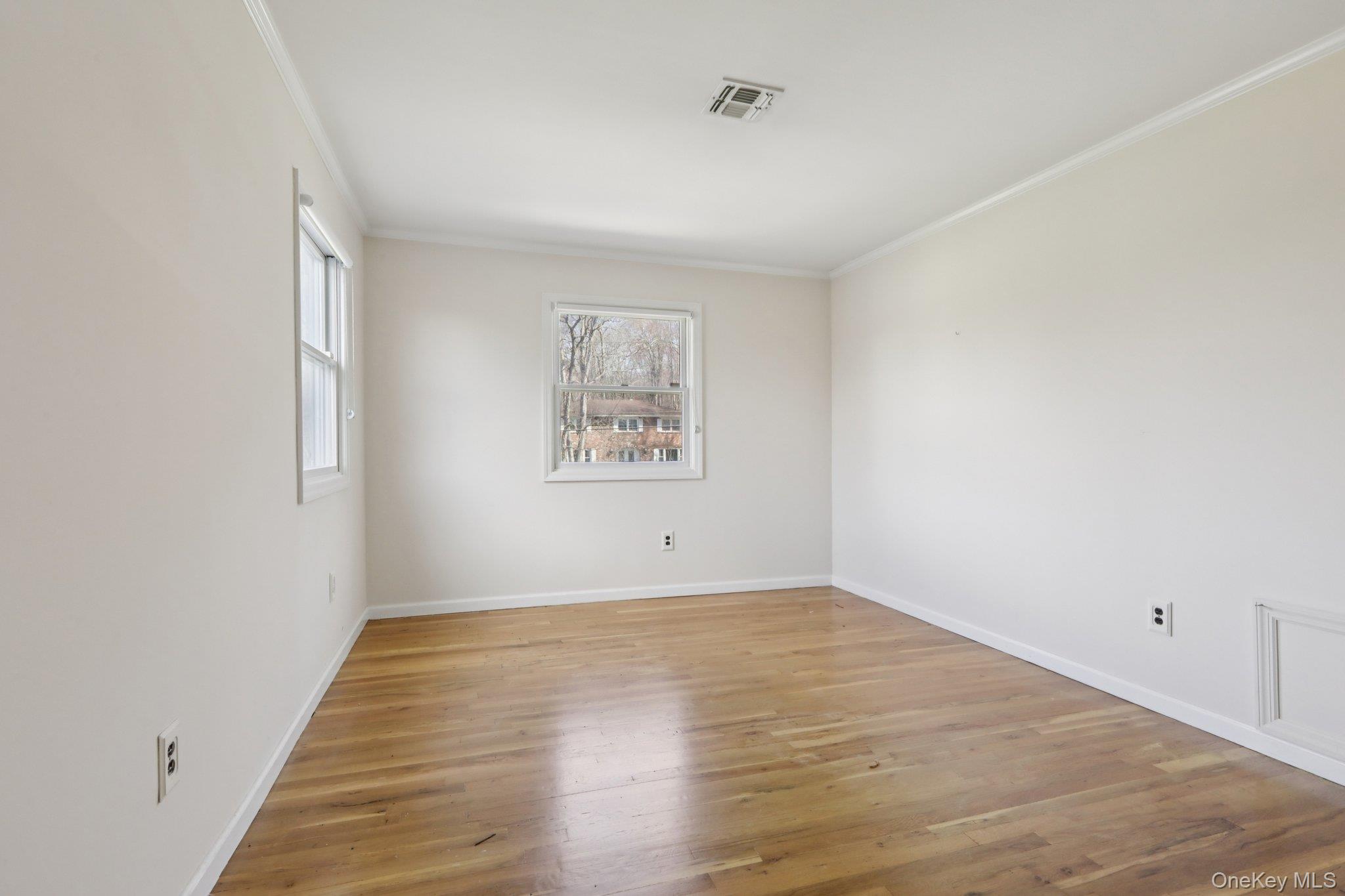 17 Rolling Ridge Road New City, NY 10956 - Photo 31 of 50 an empty room with wooden floor and windows