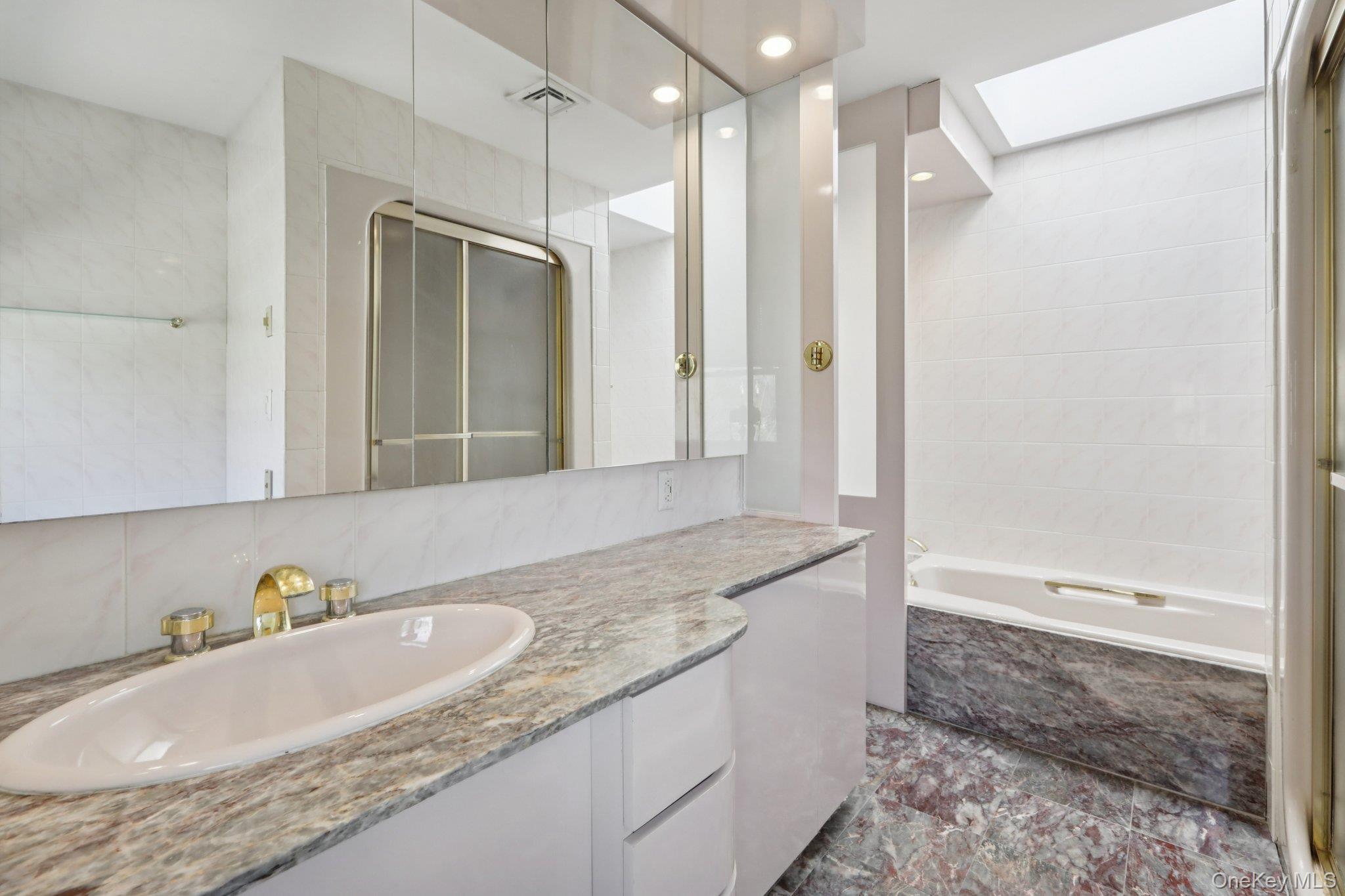 17 Rolling Ridge Road New City, NY 10956 - Photo 36 of 50 a bathroom with a granite countertop bathtub shower sink and mirror