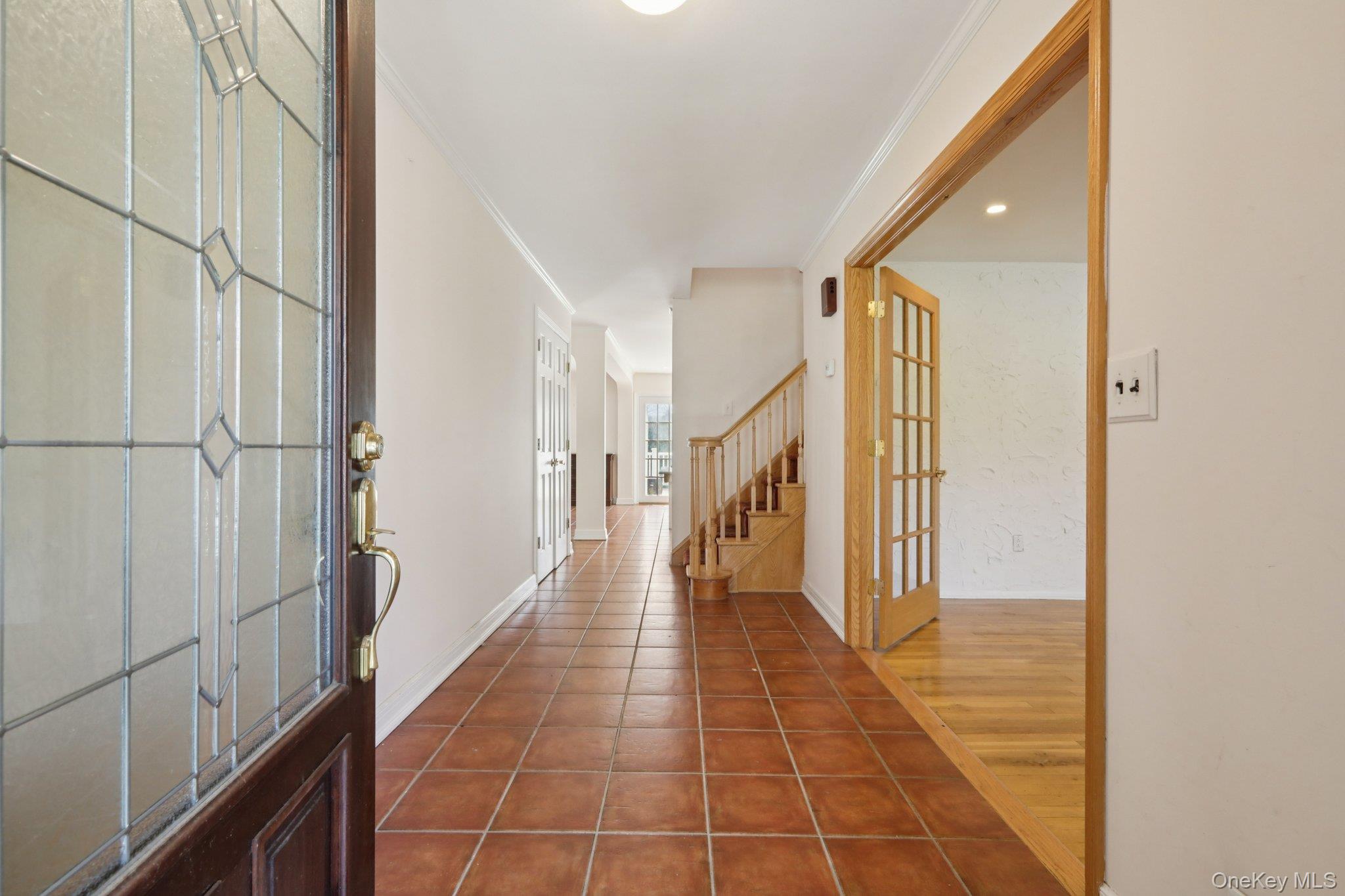 17 Rolling Ridge Road New City, NY 10956 - Photo 4 of 50 a hallway with wooden floor a rug and a window