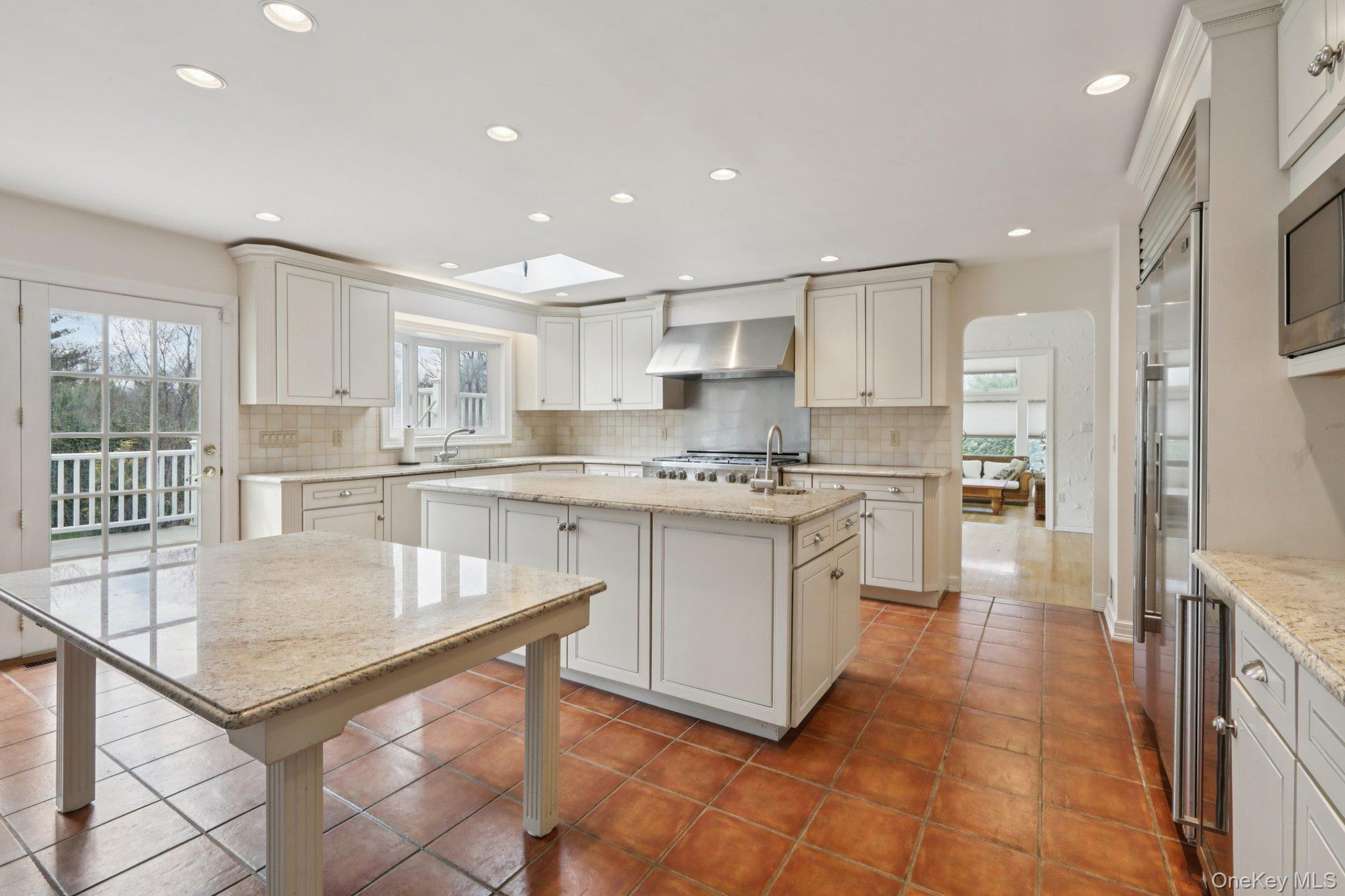 17 Rolling Ridge Road New City, NY 10956 - Photo 8 of 50 a kitchen with stainless steel appliances granite countertop a table chairs sink and cabinets