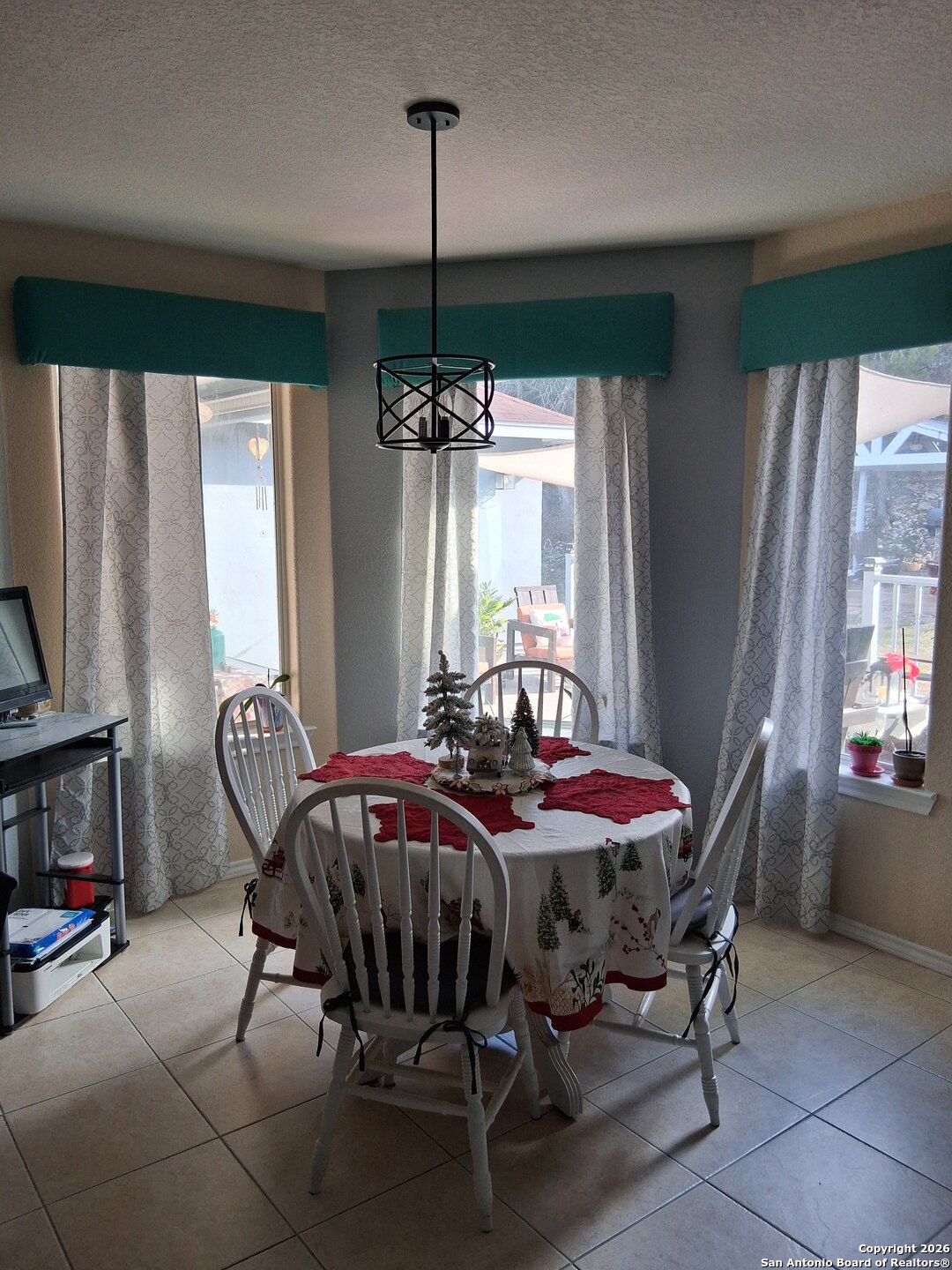 7061 Devonshire Drive Spring Branch, TX 78070 - Photo 14 of 52 a dining room with furniture a chandelier and window