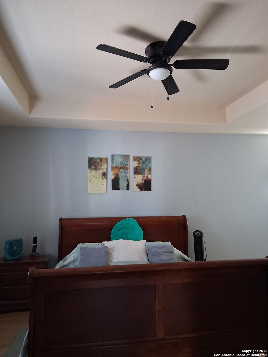 7061 Devonshire Drive Spring Branch, TX 78070 - Photo 23 of 52 a bedroom with a bed and ceiling fan