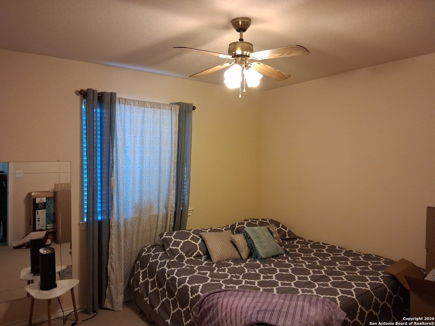 7061 Devonshire Drive Spring Branch, TX 78070 - Photo 30 of 52 a bedroom with a bed and a chandelier