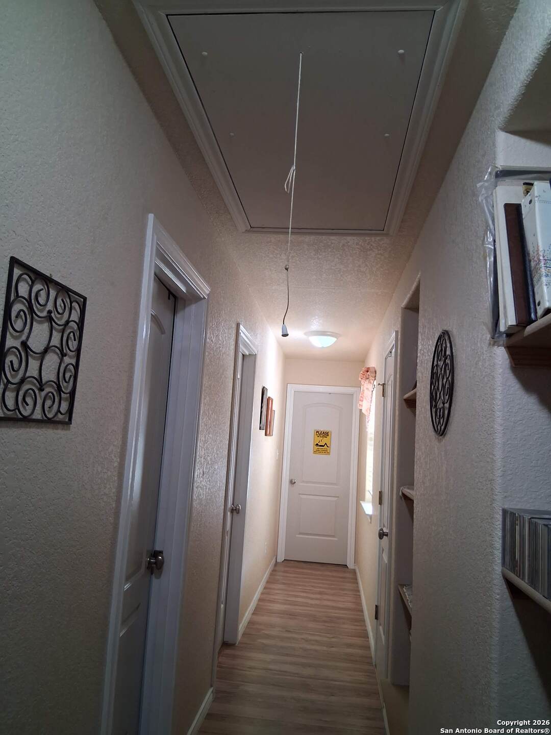 7061 Devonshire Drive Spring Branch, TX 78070 - Photo 31 of 52 a view of a hallway with wooden floor