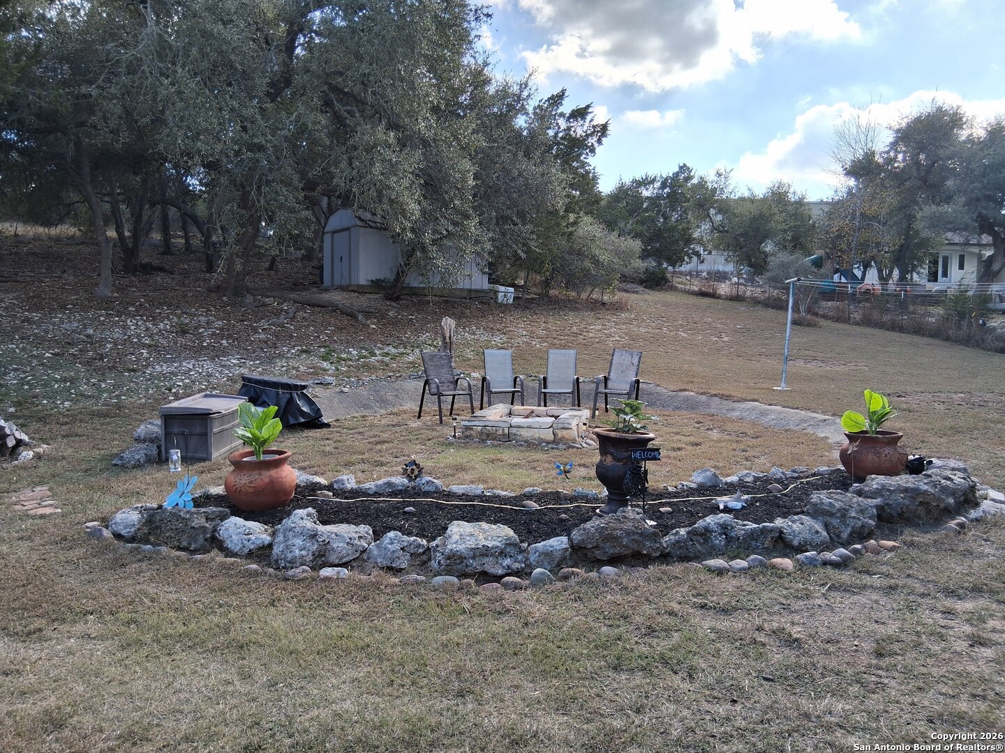 7061 Devonshire Drive Spring Branch, TX 78070 - Photo 44 of 52 a view of a lake with a sitting area