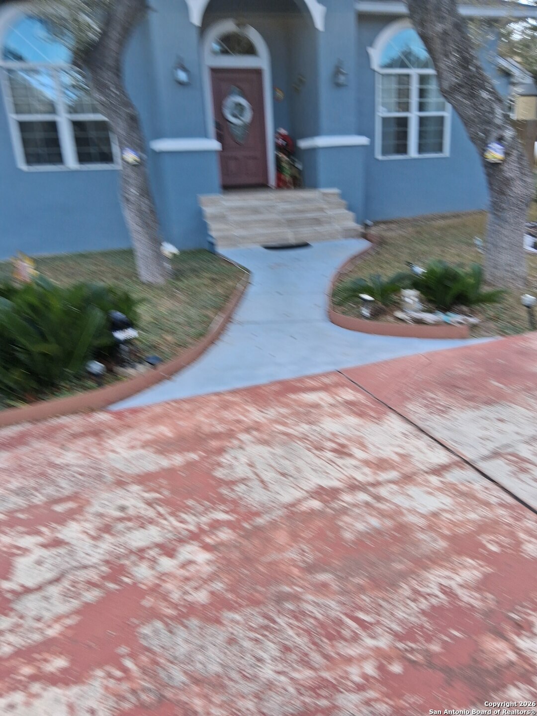 7061 Devonshire Drive Spring Branch, TX 78070 - Photo 6 of 52 a front view of a house with garden