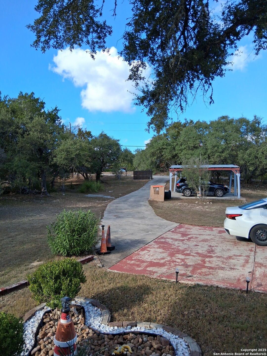 7061 Devonshire Drive Spring Branch, TX 78070 - Photo 7 of 52 a view of a street with cars