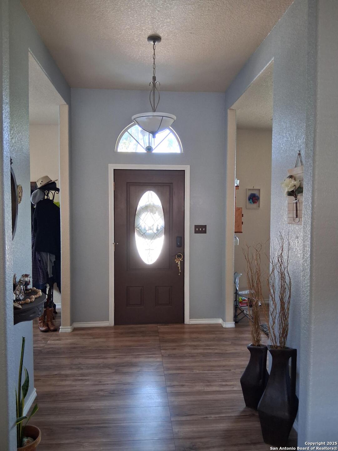 7061 Devonshire Drive Spring Branch, TX 78070 - Photo 10 of 52 a view of a hallway with wooden floor and staircase