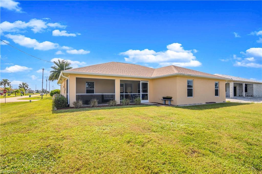 113 Northeast 29th Street Cape Coral, FL 33909 - Photo 16 of 19 a view of a house with a backyard