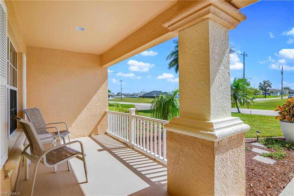 113 Northeast 29th Street Cape Coral, FL 33909 - Photo 18 of 19 a view of a patio with a table and chairs
