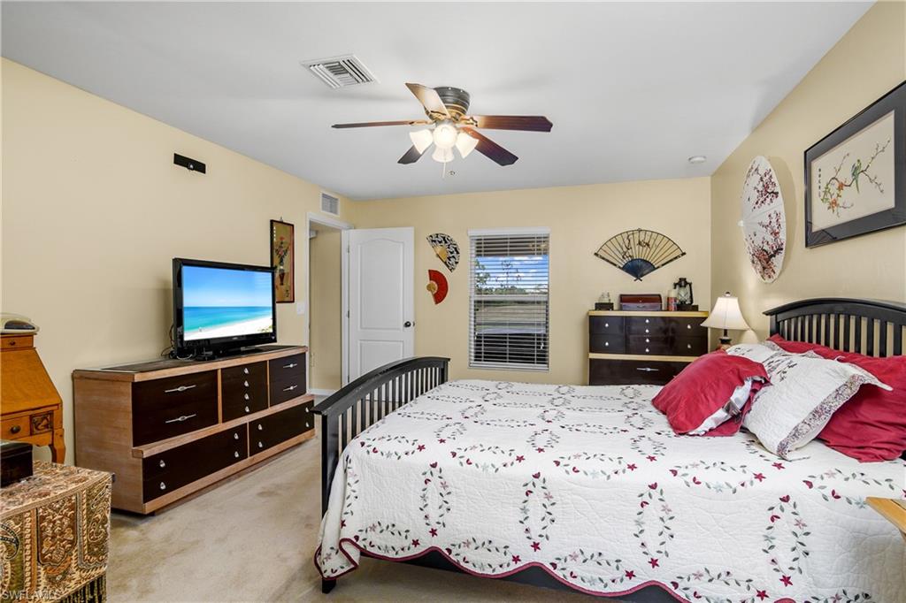 113 Northeast 29th Street Cape Coral, FL 33909 - Photo 10 of 19 a bedroom with a bed and dresser