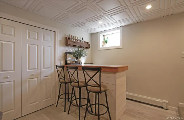 a view of a dining room with furniture and window