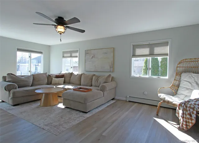 a living room with furniture and a window