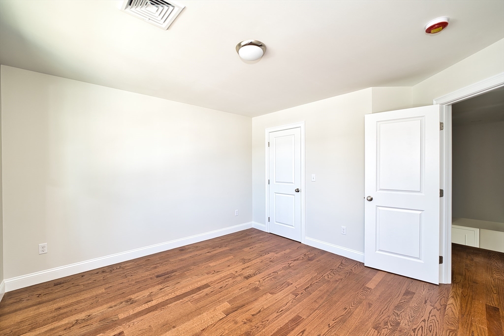 124 Downing Street Fall River, MA 02723 - Photo 19 of 33 a view of a room with wooden floor