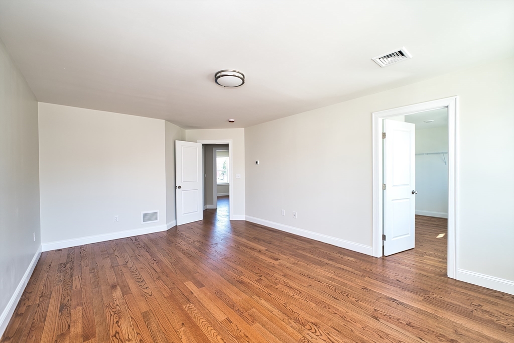 124 Downing Street Fall River, MA 02723 - Photo 21 of 33 a view of an empty room with wooden floor