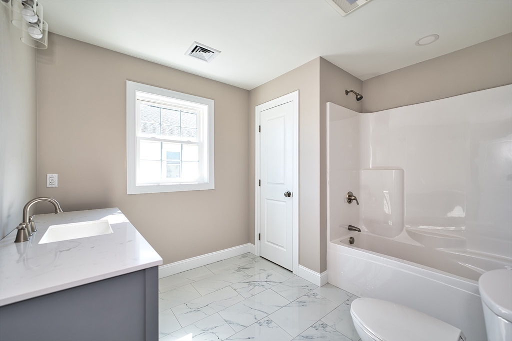 124 Downing Street Fall River, MA 02723 - Photo 25 of 33 a bathroom with a sink toilet and shower