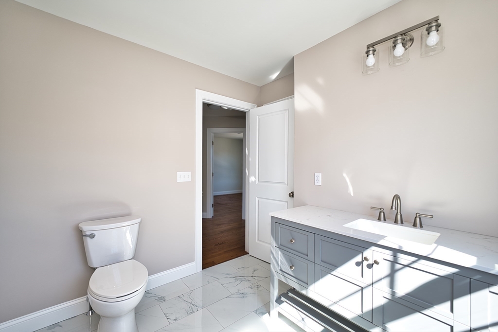 124 Downing Street Fall River, MA 02723 - Photo 26 of 33 a spacious bathroom with a bathtub and a toilet