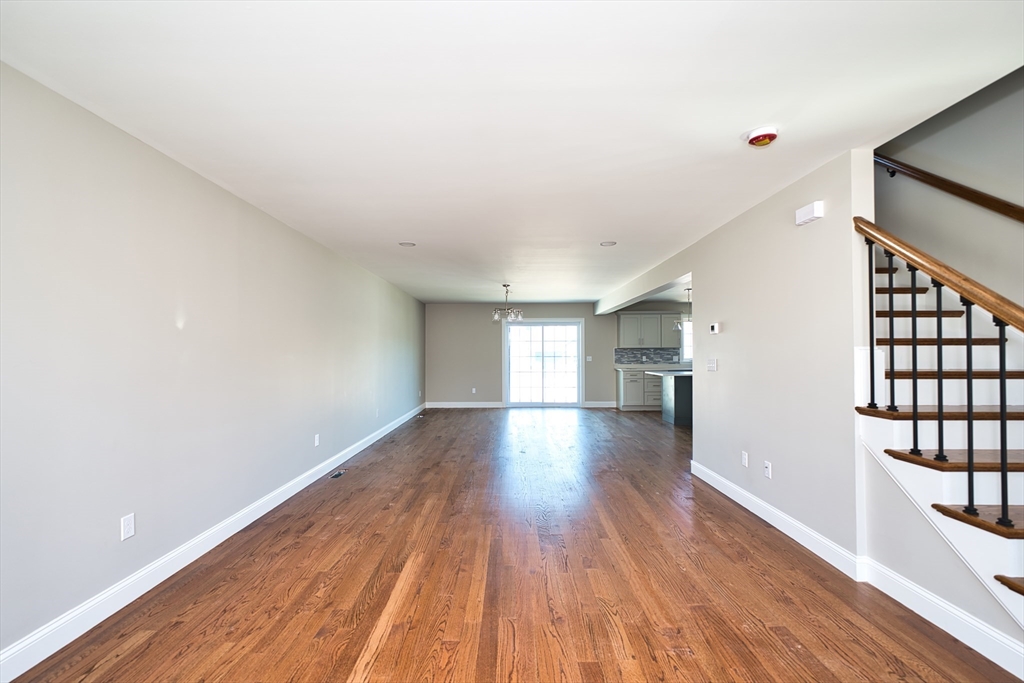 124 Downing Street Fall River, MA 02723 - Photo 6 of 33 a view of empty room with wooden floor and fan