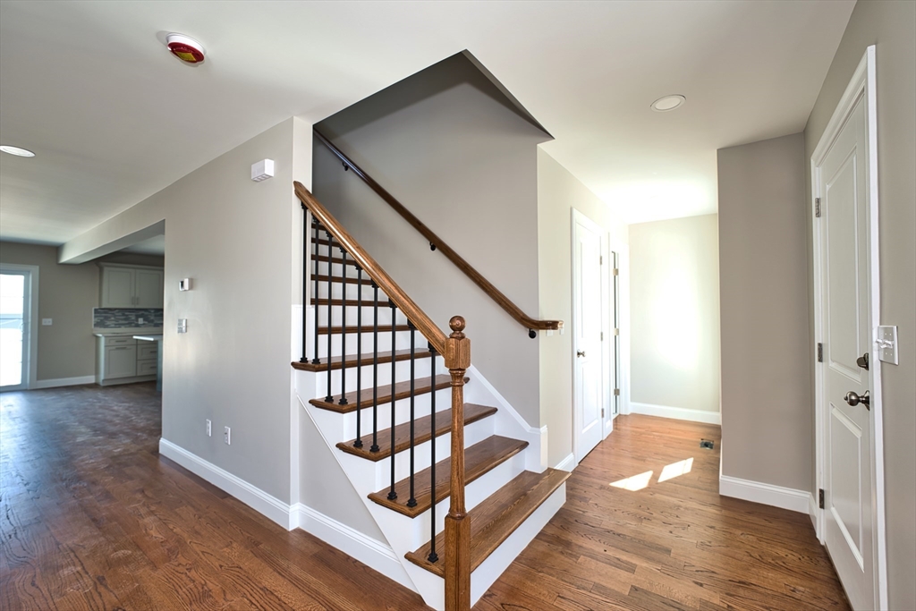 124 Downing Street Fall River, MA 02723 - Photo 8 of 33 a view of a hallway with staircase